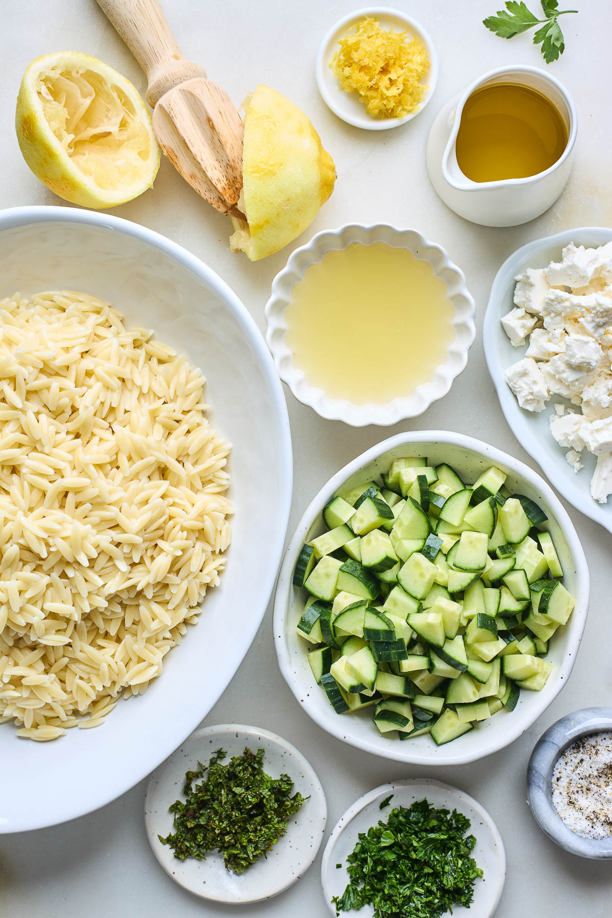 Ingredients to make a summer orzo pasta salad.