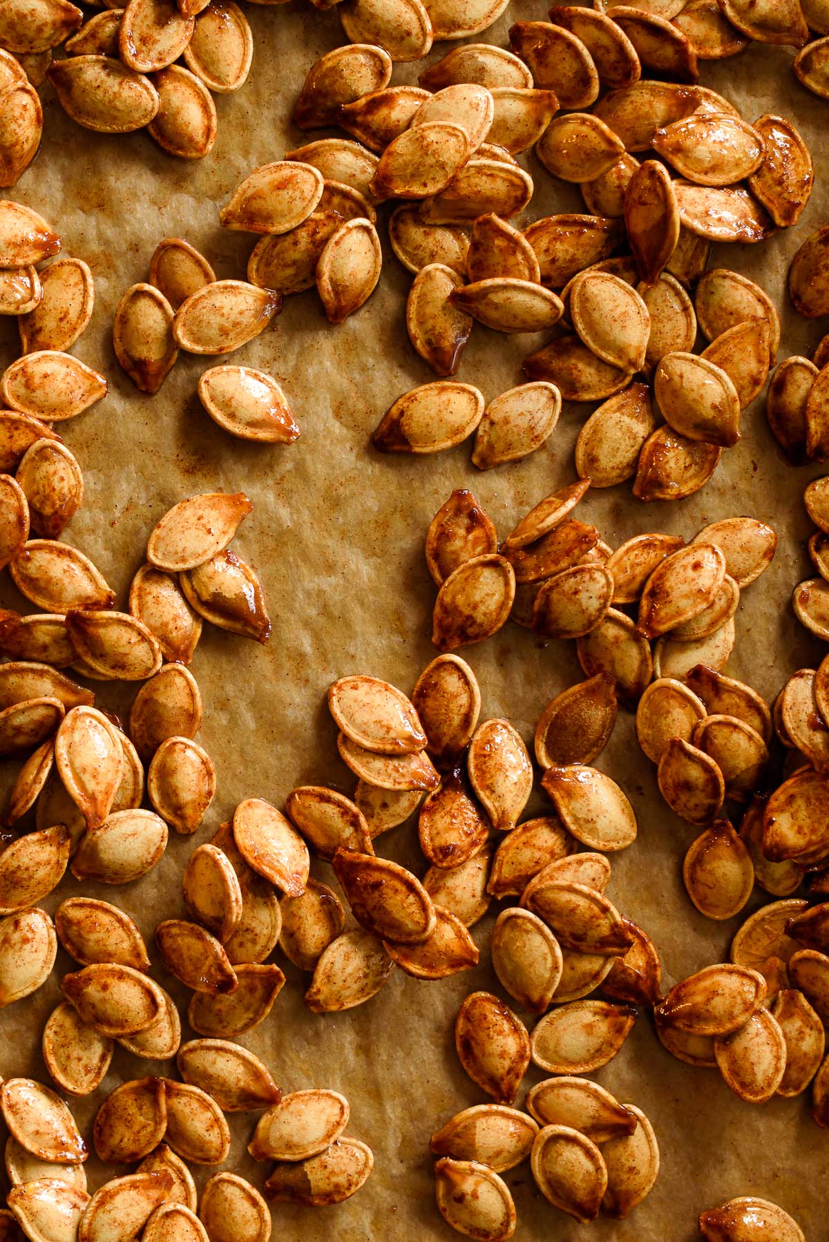 Brown sugar roasted pumpkin seeds on parchment paper