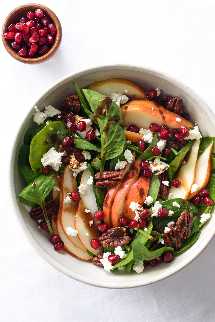 Spinach and Pear Salad with Goat Cheese, Pomegranate, and Candied Pecans via forkknifeswoon.com