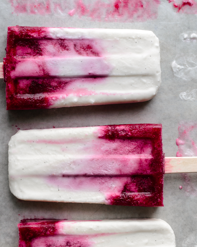 Creamy Coconut and Mixed Berry Popsicles. These refined-sugar free, vegan-optional ice pops are made with wholesome ingredients and are super easy to whip up. via forkknifeswoon.com