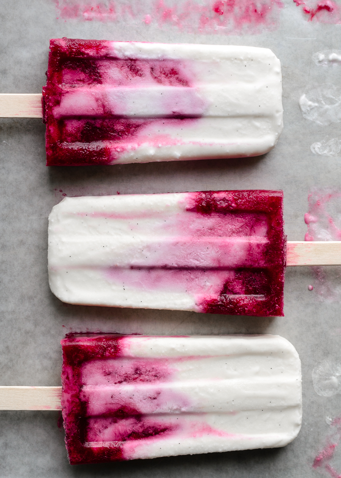 Creamy Coconut and Mixed Berry Popsicles. These refined-sugar free, vegan-optional ice pops are made with wholesome ingredients and are super easy to whip up. via forkknifeswoon.com