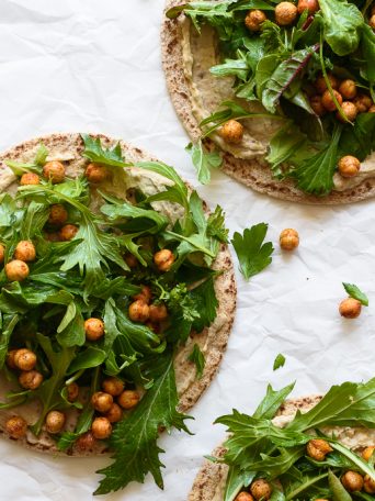 Pita Flatbreads with Hummus, Spring Greens, Crispy Chickpeas and an Herb Yogurt Sauce | via forkknifeswoon.com
