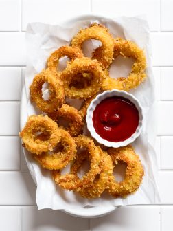 Perfectly Crispy Potato Chip Crusted Baked Onion Rings | via forkknifeswoon.com