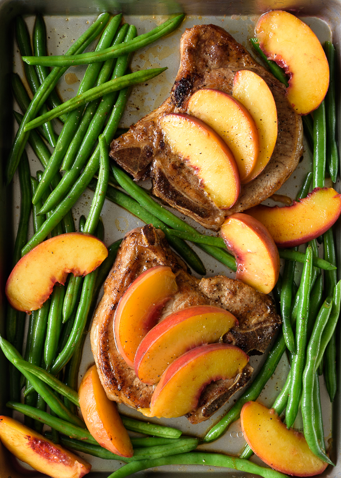 Pan seared and baked pork chops on a sheet pan with brown sugar peaches and green beans | via forkknifeswoon.com @forkknifeswoon