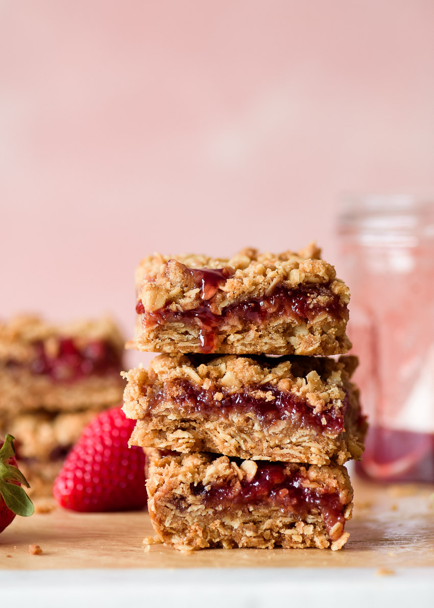 a stack of strawberry jam crumble bars from forkknifeswoon.com