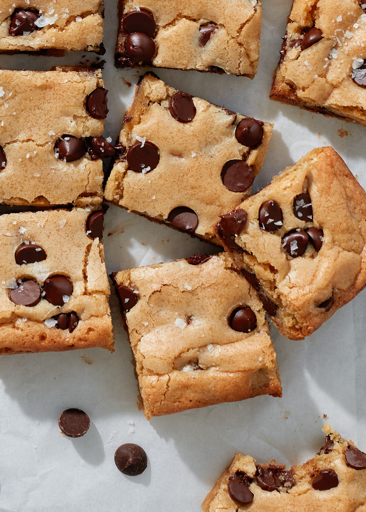 Close up of sliced chocolate chip cookie bars with melted chocolate chips.